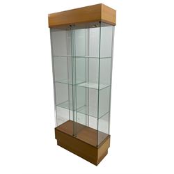 Light oak and glass double open display cabinet, glazed back and sides with two divisions, each with three shelves, light fitting to top of each section