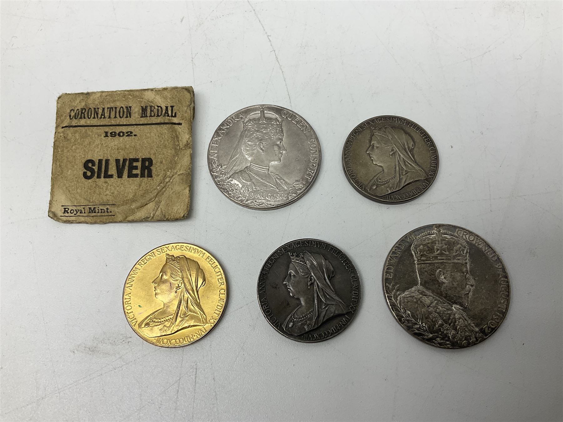 Commemorative medallions or medals including three Queen Victoria Diamond Jubilee small silver medallions, two King Edward VII 1902 Coronation medallions and a Queen Elizabeth II 1953 Coronation medal in red box