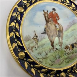 Pair of Royal Crown Derby miniature plaques, circa 1954-1955, of circular form, centrally painted with fox hunting scenes, within gilt husk and cobalt blue border, D8cm