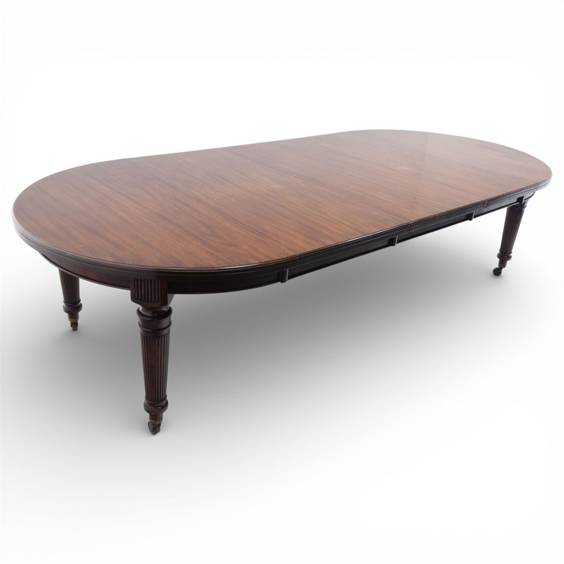 Spillman & Co. London - large Victorian mahogany extending dining table with three additional leaves, upon turned and reeded supports with ceramic castors, bearing ivorine label beneath detailed 'Spillman & Co. St. Martins Lane, London', extends to 302cm