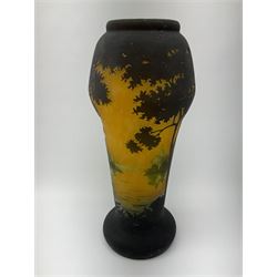 Reproduction Daum Nancy art nouveau style overlay and cut glass vase  decorated with woodland and a lake scene on a yellow ground, H35cm. 