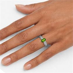 9ct white gold tsavorite garnet and diamond ring, single oval cut garnet with pave set diamond shoulders, Birmingham 2008