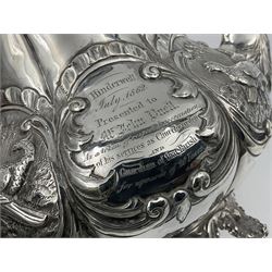 Victorian silver three piece tea service, comprising teapot, twin handled open sucrier, and milk jug, each of bellied form with acanthus capped scroll handles, the sides embossed with alternating scroll edged vacant panels and panels containing a pair of birds, upon four palmette feet, the teapot with ivory insulators to handle, and bird finial to the hinged domed cover, hallmarked William Hunter & Son, London 1861, teapot H19cm, including handles sucrier H13.5cm, including handle milk jug H12cm

This item has been registered for sale under Section 10 of the APHA Ivory Act