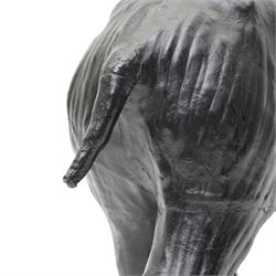 In the style of Liberty & Co - pair of 20th century ebonised papier mache elephants 