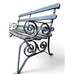 Coalbrookdale - rare pair of wrought iron and slatted wood garden benches, the twin wrought iron strapwork bench-ends formed of four scrolls over splayed feet, number 77 in the Coalbrookdale Castings Catalogue (see illustration)