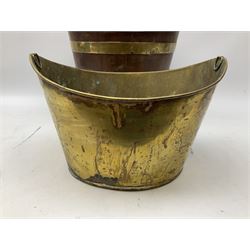 Georgian brass banded mahogany coal bucket, of oval form having brass coopered barrel type bands, swing handle atop and inset brass bucket