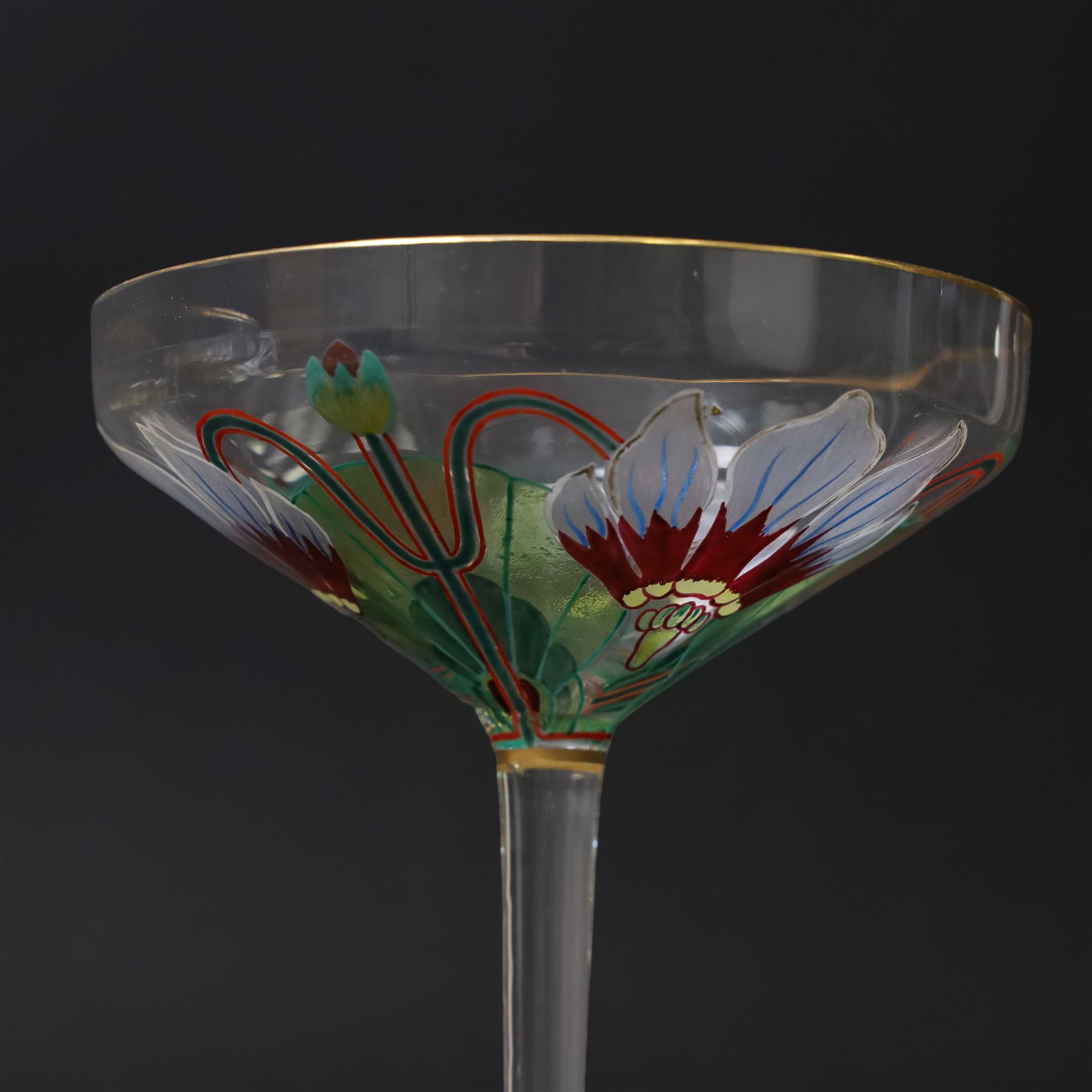 Pair of early 20th century Theresienthal Art Nouveau hand painted glass champagne coupes, the bowls hand painted with flowers, the bowl and foot rims lined in gilt, H13.5cm