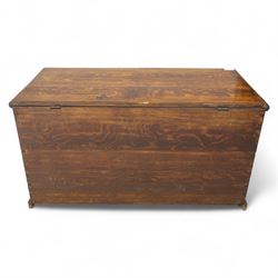 19th century oak blanket chest, rectangular hinged plank top with moulded edge, plain sides fitted with iron carrying handles, single full-width drawer to base with brass drop handles, on moulded plinth base