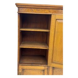 Late Victorian pollard oak bookcase or sideboard, the central glazed door opening to reveal adjustable shelves and interior makers label 