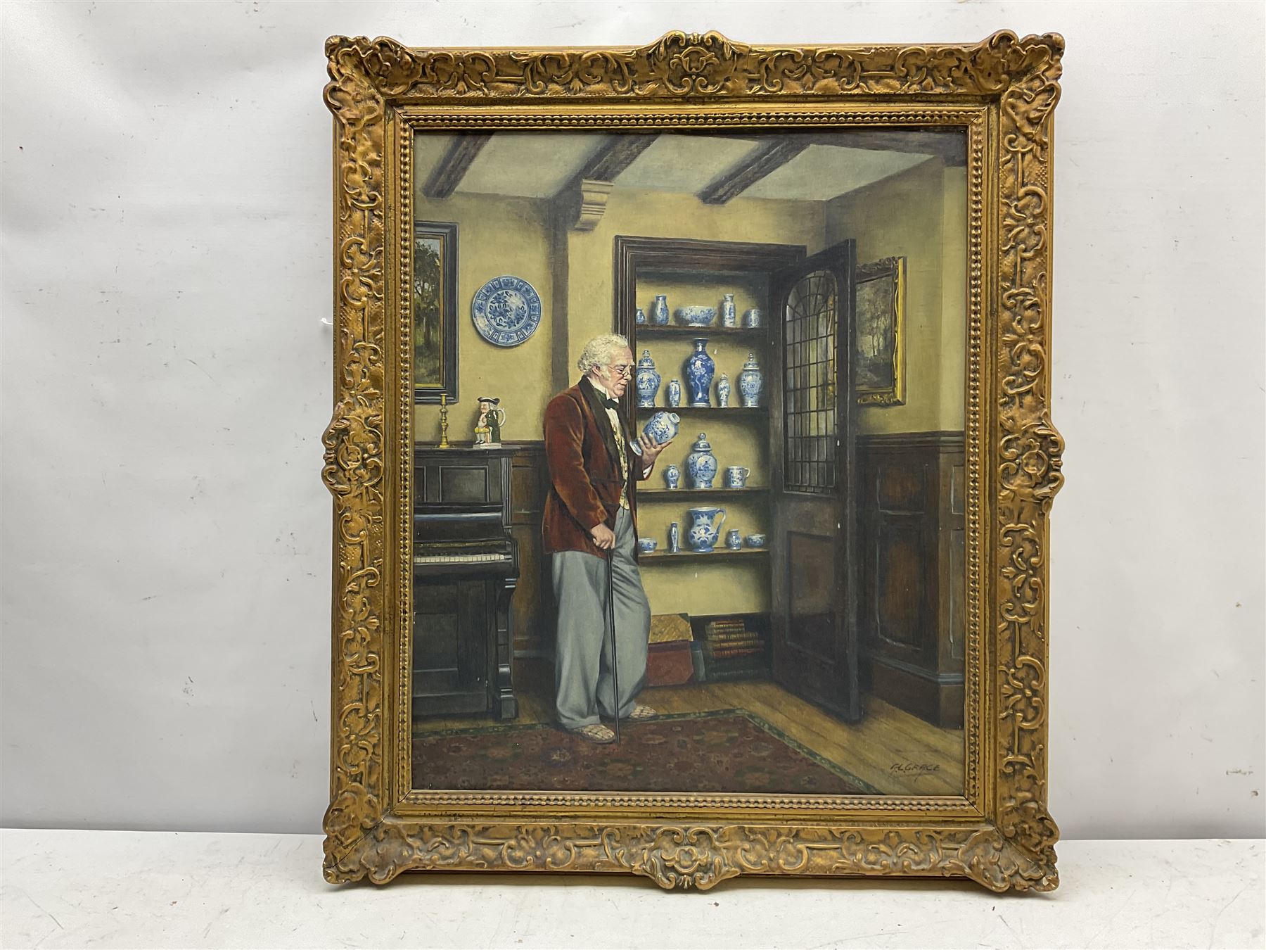 A L Grace (British 20th century): The Connoisseur and the China Cupboard, oil on canvas signed, the canvas stamped 'Prepared by C Roberson & Co Ltd, 71 Parkway, London NW1' (used 1939/67), 60cm x 50cm