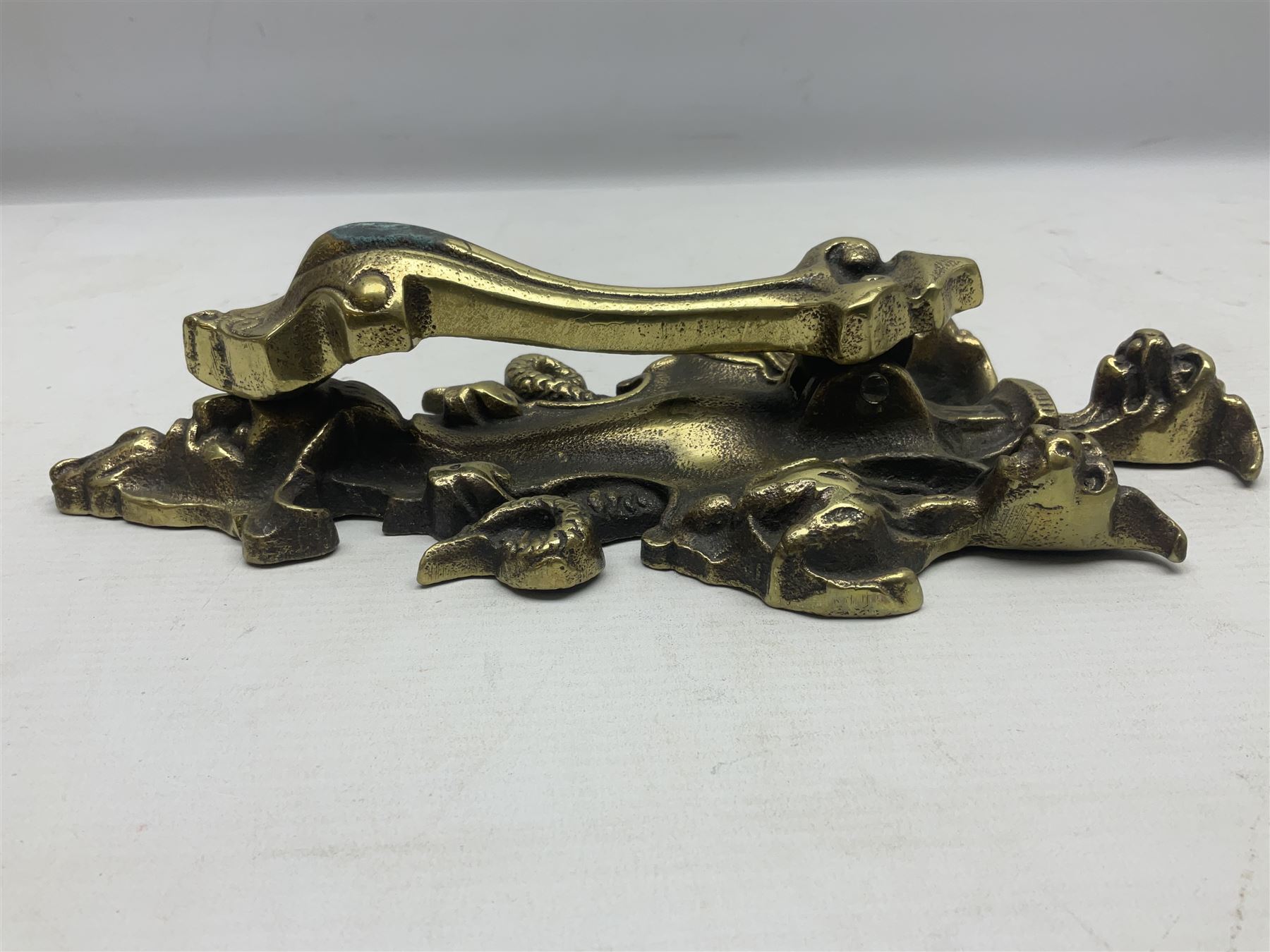 Gothic style cast brass door knocker, modelled with the Greek three-headed hell hound Cerberus on Rococo style base with central knocker of tear drop above Hades, God of the underworld, L29cm