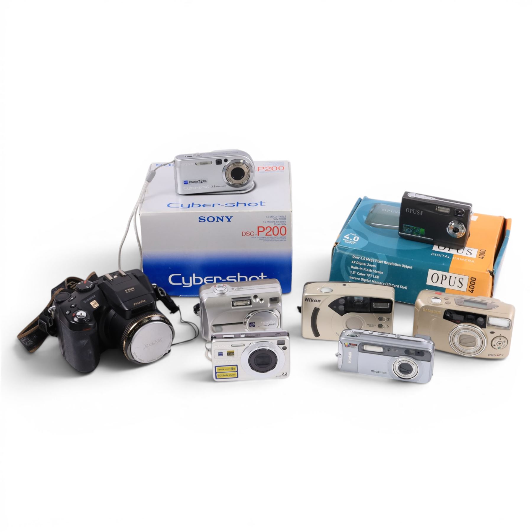 Eight digital cameras, comprising Sony DSC-P200, Opus 4000, Nikon Fun Touch 6, Fujifilm Finepix A405, Sony Cybershot, Samsung Vega 140, Fujifilm S7000 and Kodak Easy Share LS753, two boxed