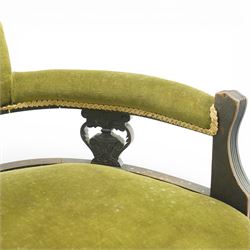 Late 19th century upholstered settee, shaped padded back with a row of button detailing, downswept open arms with upholstered pads, upholstered in olive green velvet, the frame with moulded rails and raised on turned front supports and out-swept rear legs with castors