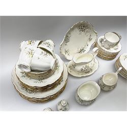 Royal Albert Haworth pattern tea and dinner wares, comprising eight dinner plates, ten salad plates, fourteen side plates, eight bowls, sauce boat and stand, pair of cruets, six tea cups and six saucers, cream jug, open sucrier, and cake plate. 