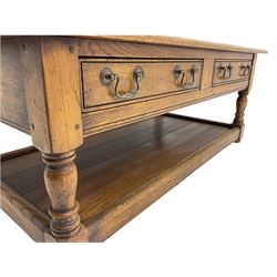 Rectangular oak coffee table, fitted with two drawers turned supports joined by undertier 