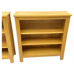 Five light wood open bookcases, four with two adjustable shelves, (W89cm, D29cm, H94cm), one with one adjustable shelf (W89cm, D29cm, H77cm)  