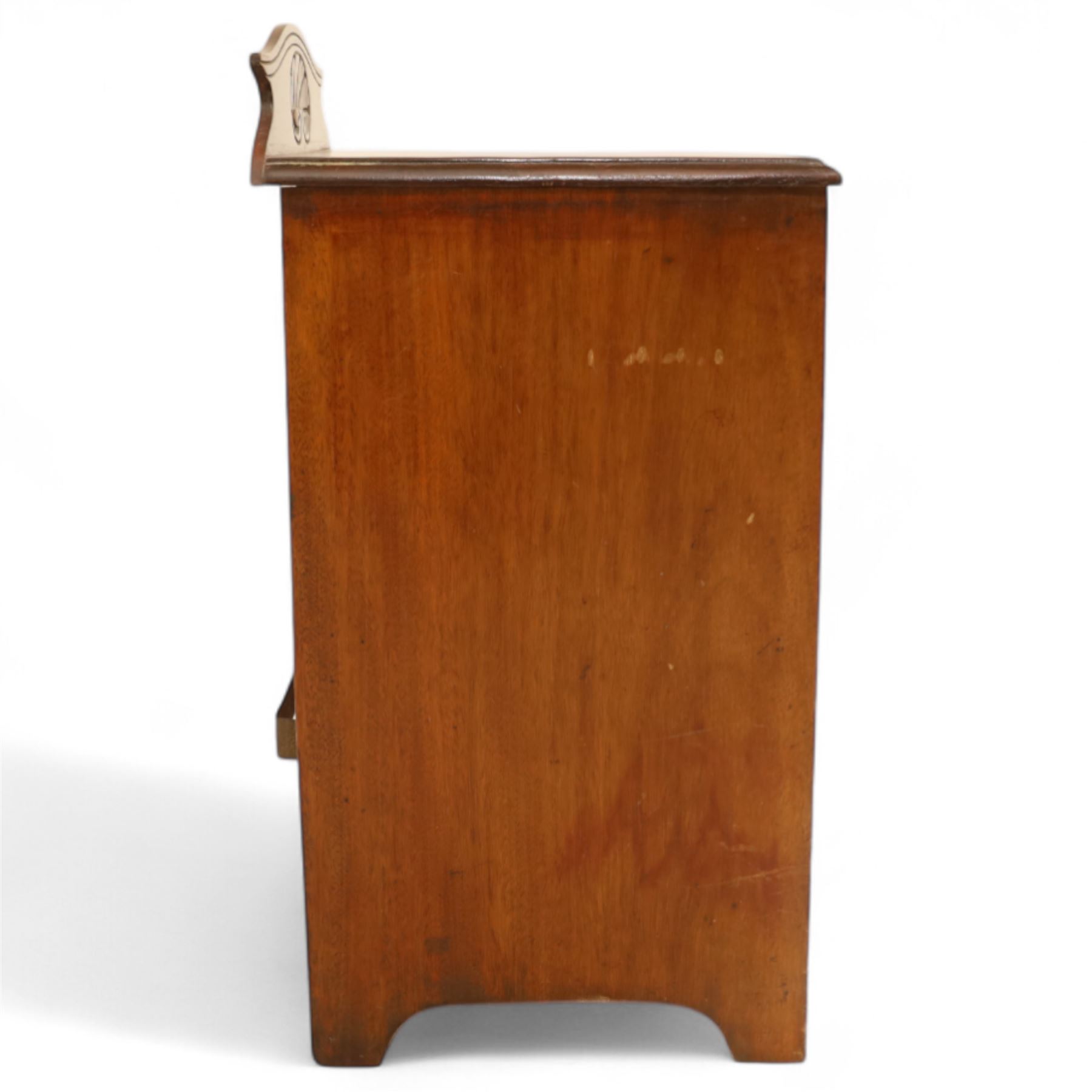 19th century mahogany coal scuttle, shaped raised back carved with shell fan motif, swing front enclosing original removable metal liner with handle, panelled front with cast drop handle, over slatted undertier (H 65cm, W 33cm, D 34cm)
Early 20th century mahogany magazine table, rectangular top and undertier decorated with gilt foliate and scroll marquetry, shaped pierced side rails forming magazine divisions, on square tapering supports (H 70cm, W 71cm, D 45cm)