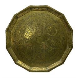Eastern brass faceted tray with impressed script and scrolling decoration D48cm. 