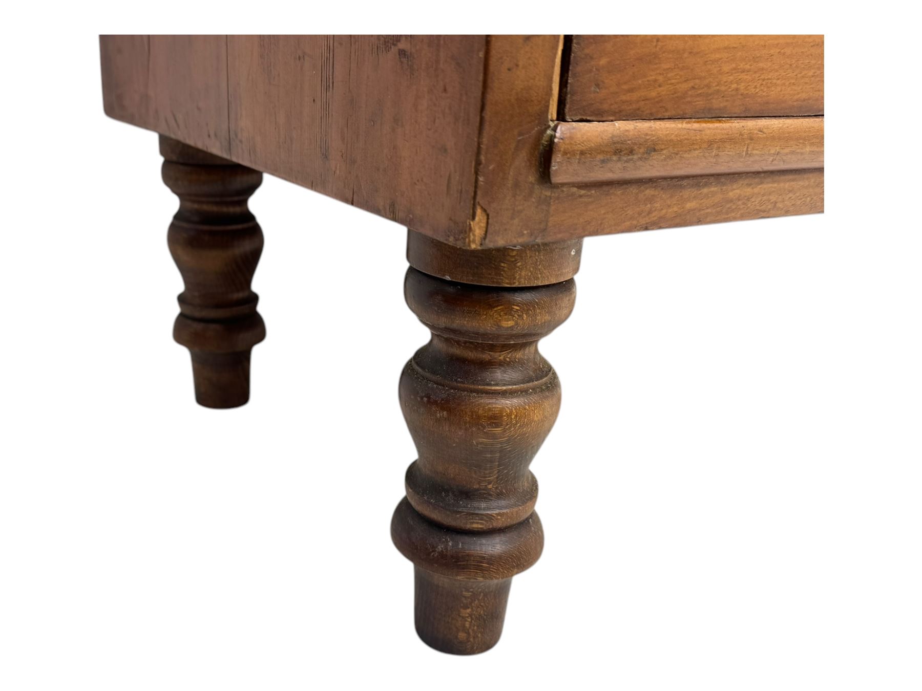 Late Victorian mahogany chest of drawers, with rectangular top over two short and three long graduated drawers, each fitted with ebonised turned knob handles and keyholes, raised on turned supports