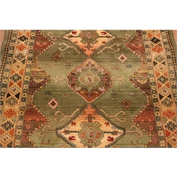  Persian style green ground rug, 235cm x 160cm  