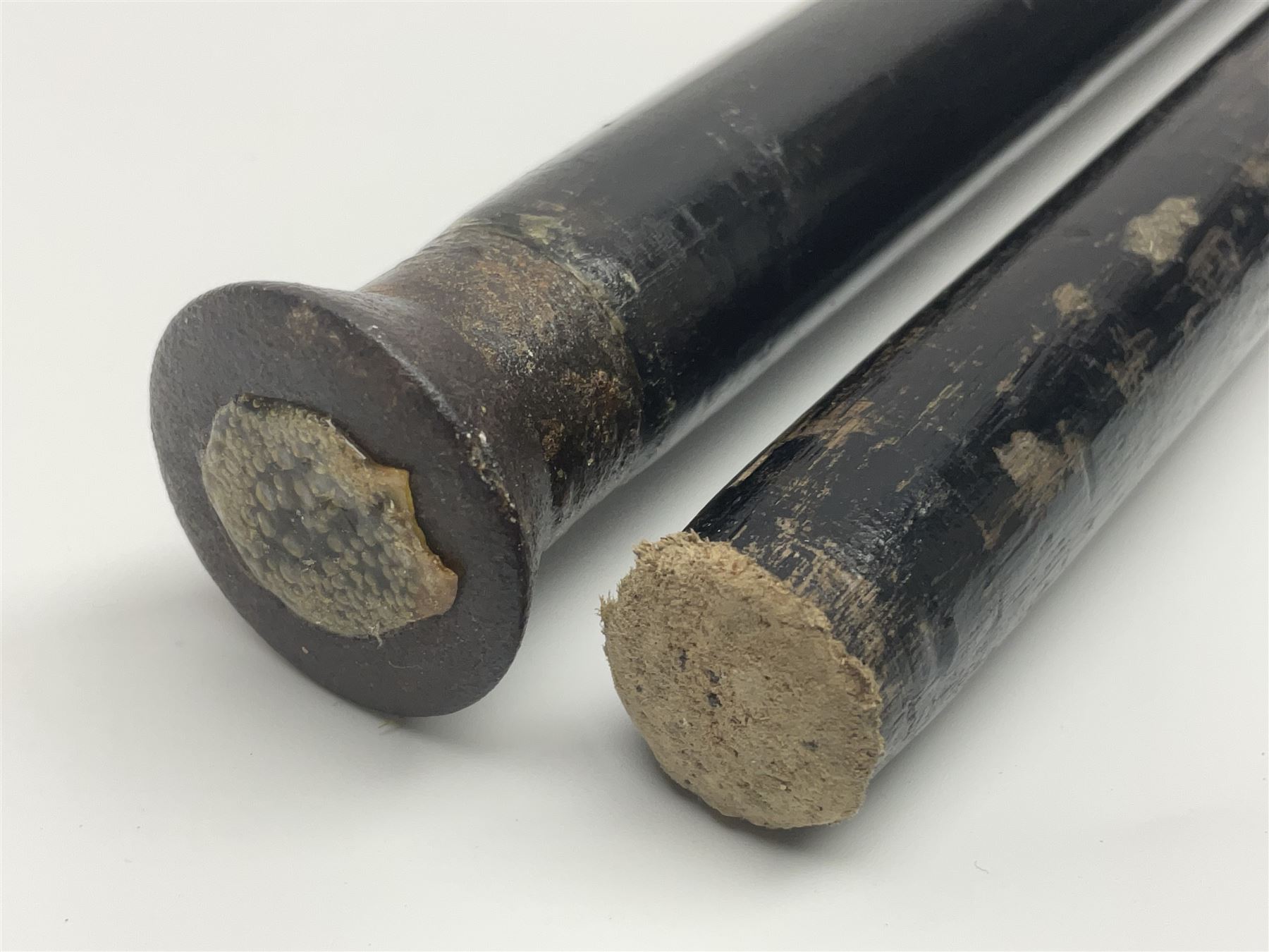 Two ebonised walking sticks, one with 'Leeds City Police' embossed top, tallest H92cm