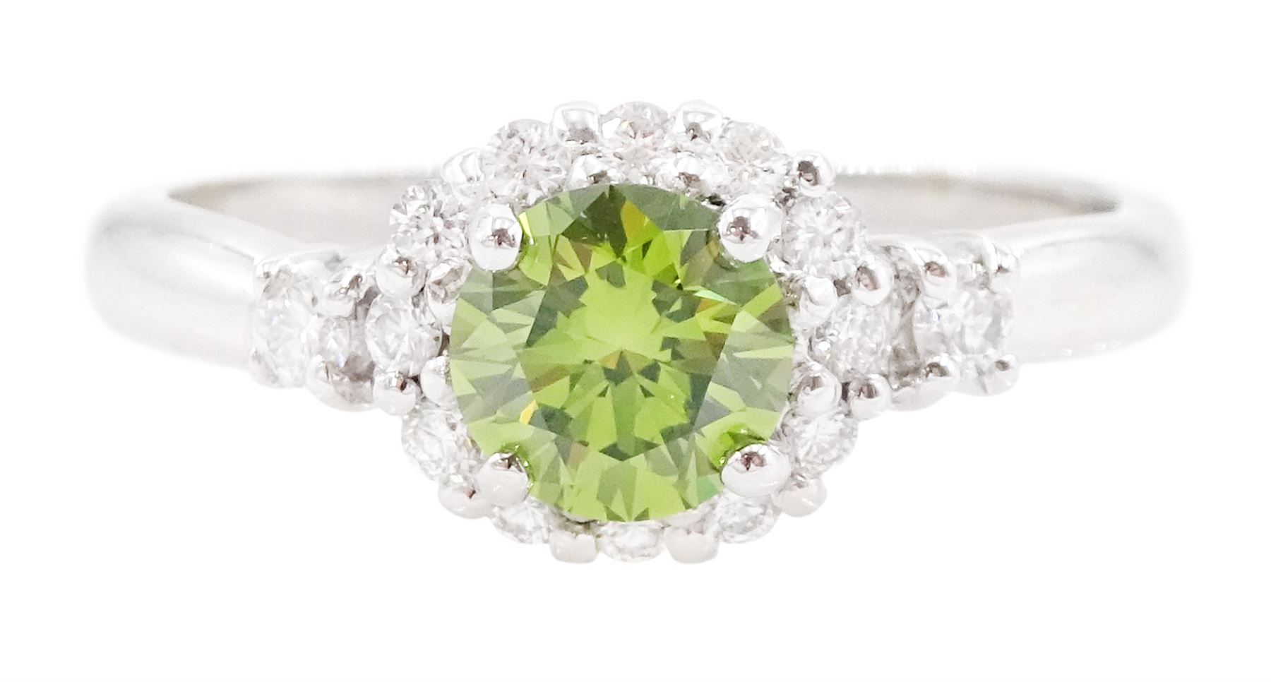 18ct white gold diamond cluster ring, the principal round brilliant cut fancy green diamond of approx 0.65 carat, surrounded by round brilliant cut white diamonds and diamond set shoulders, Birmingham 2007, total white diamond approx 0.20 carat