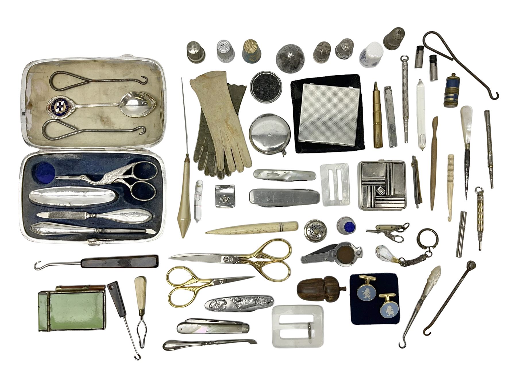 Pair of Wedgewood jasperware unicorn cufflinks, silver handled part manicure set, enamel flip notebook, dolls leather gloves, Stratton compact, and a collection of sewing accessories including thimbles, button hooks, thimble holder, scissors etc 