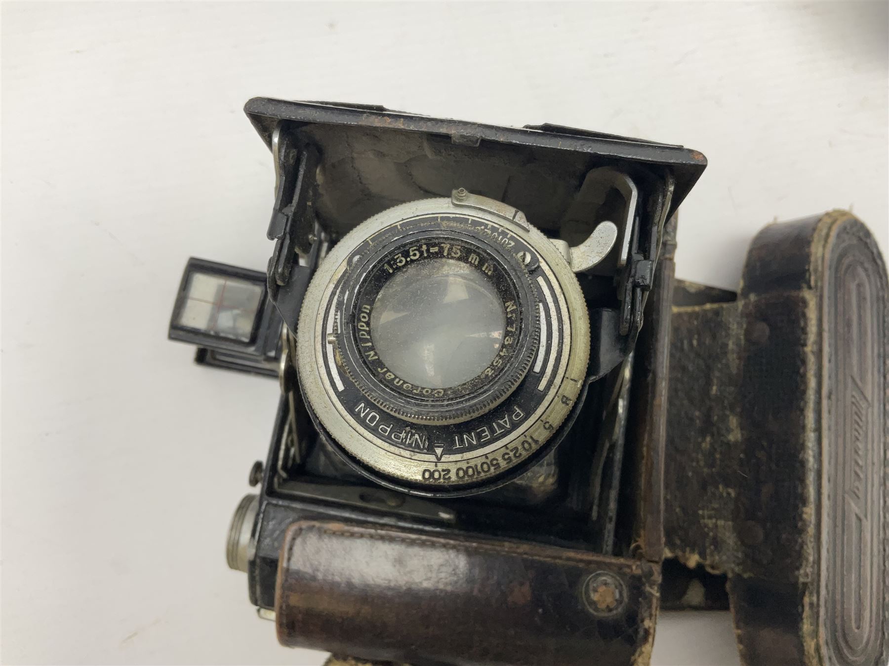 Canon A1 camera body, serial no 775843, together with 'Canon Lens FD 200mm 1:4 lens' serial no 24432, together with Semi Minolta folding camera, Canon 'Zoom FD 35-105mm 1:3.5-4.5' lens, Canon 'Macro Focusing Zoom 72mm Hanimex HMC 28-200mm' lens and other camera equipment  