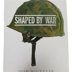 McCullin, Don: three hardback books, comprising 'Shaped by War', 'Hearts of Darkness' and a self titled example, together with a framed Times magazine cover depicting the photographer in black and white, signed to the left hand side