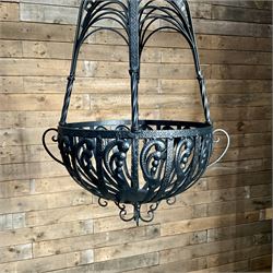 Pair of black finish wrought metal hanging baskets, with brackets