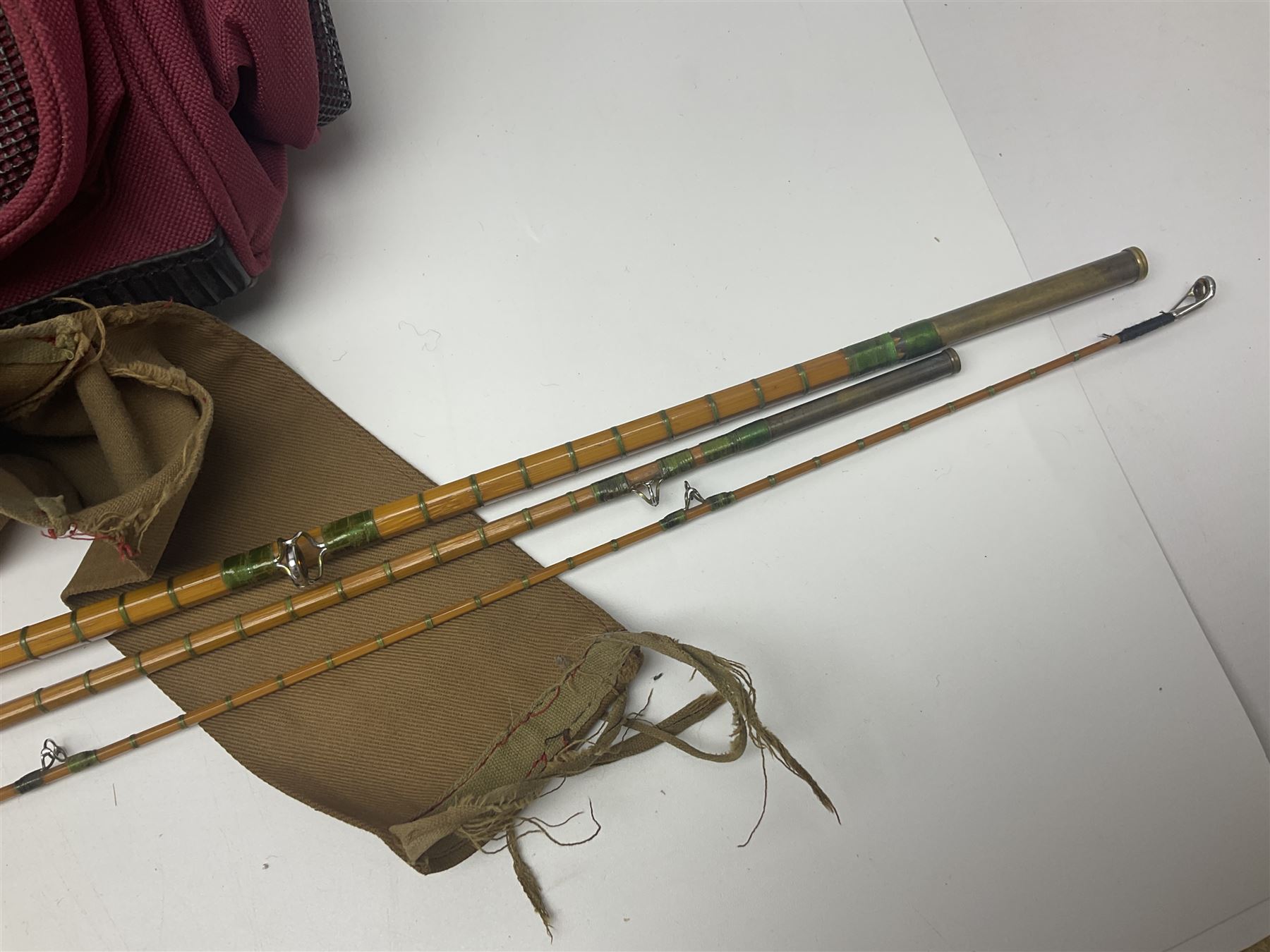 Collection of fishing memorabillia and equipment, including an Allcocks three piece split cane trout fly rod, Shakespeare Salt 3600 surf rod, two tackle bags, Old Red Seastreak multiplier reel, Sportext Saltwater fixed spool reel, fishing dvds, etc