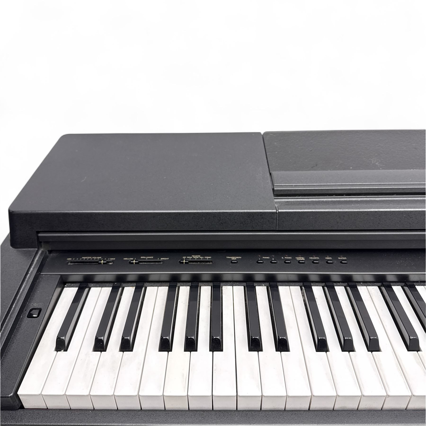 Yamaha Clavinova CLP-550 digital piano, full-size weighted keyboard with integrated pedals and speakers, in dark wood effect casing, accompanied by matching padded bench, Sennheiser headphones, original manuals, and factory-issued cassette tape titled 'Pure & Simple – CLP Digital Pianos'