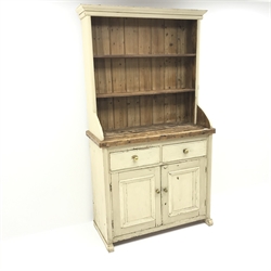 Solid pine dresser in painted cream finish, raised two tier plate rack above two drawers and two cupboards, arched sledge feet, W112cm, H204cm, D51cm  