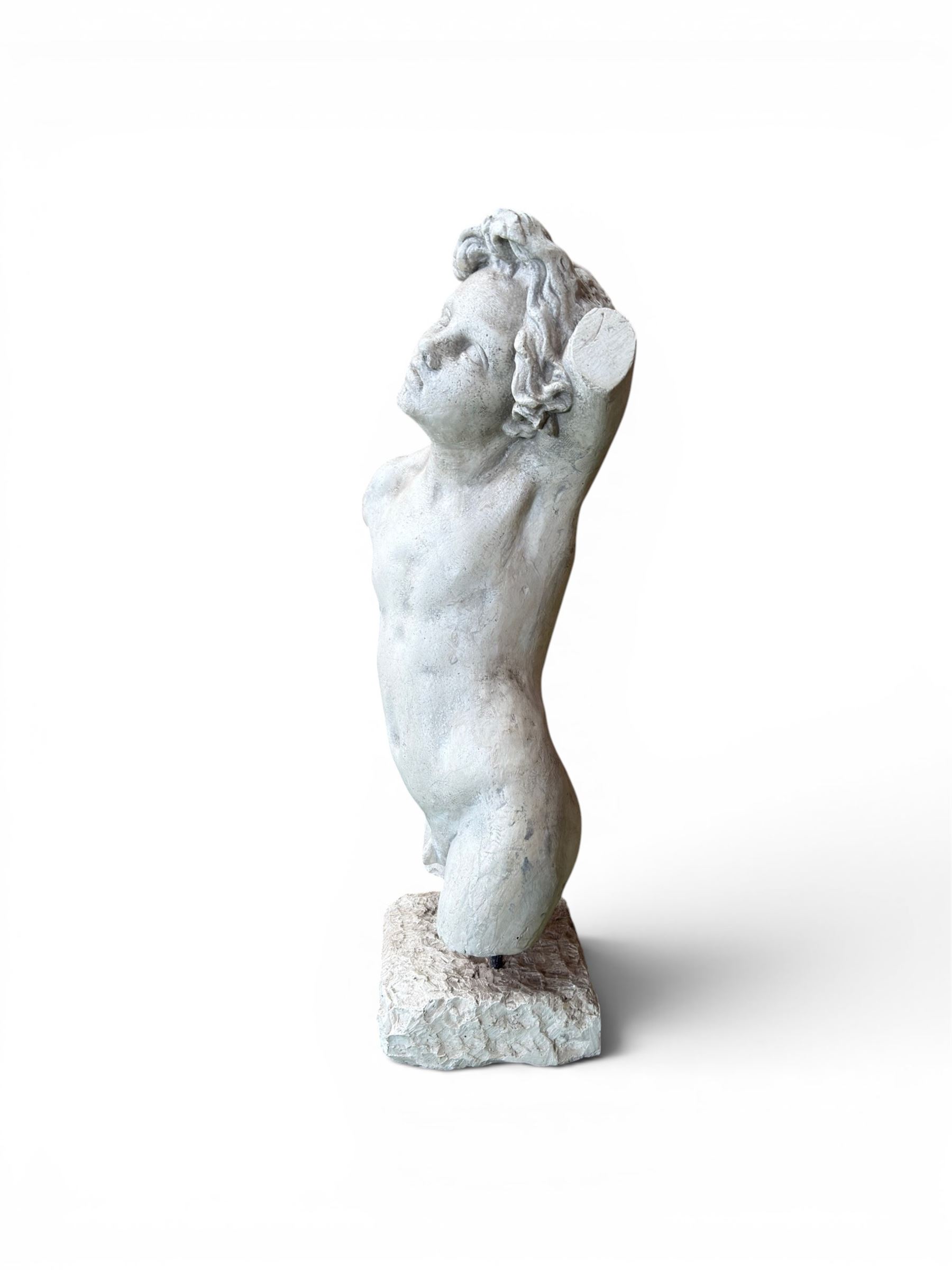 Early 20th century sculptured painted plaster figure of a boys torso, raised on 'stone' plinth