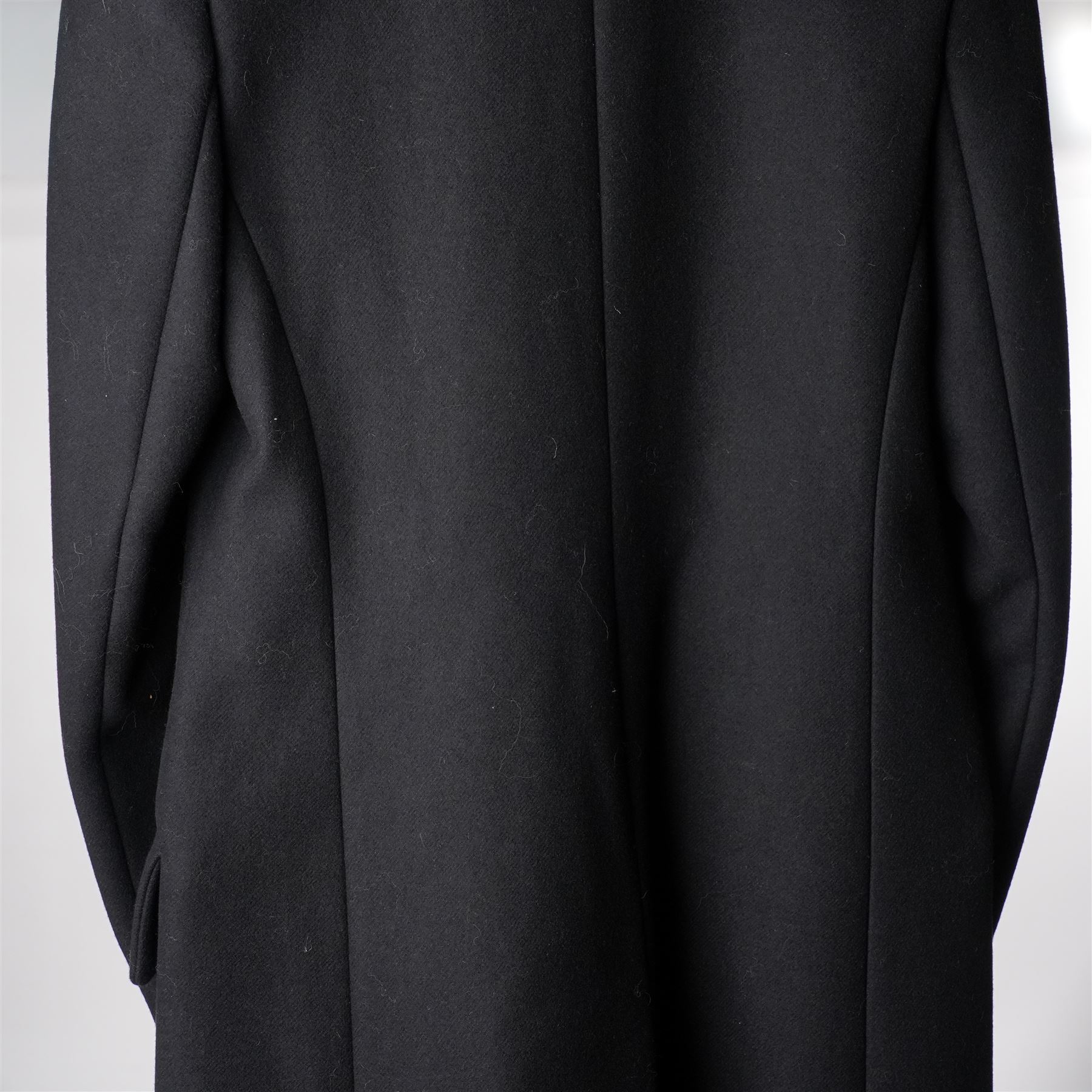 Prada - black Melton wool coat, in a redingote style with front fastening and fabric-covered buttons, flap pockets and a structured collar with slit to the back, size 44, unused with the original garment bag and hanger