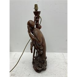 Carved hardwood table lamp modelled as a figure of an immortal, H66cm incl fitting
