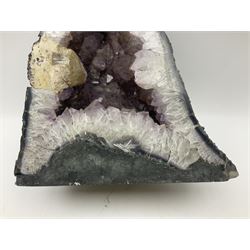 Amethyst crystal ‘cathedral’ geode, free standing with flat base and prepared outer surface, with well-defined crystals of various sizes within the cavern, H39, L32cm