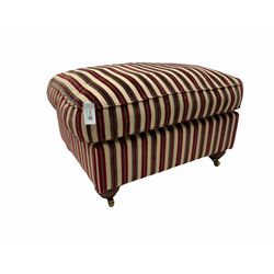 Rectangular footstool upholstered in beige and red striped fabric, mahogany bun feet with brass castors