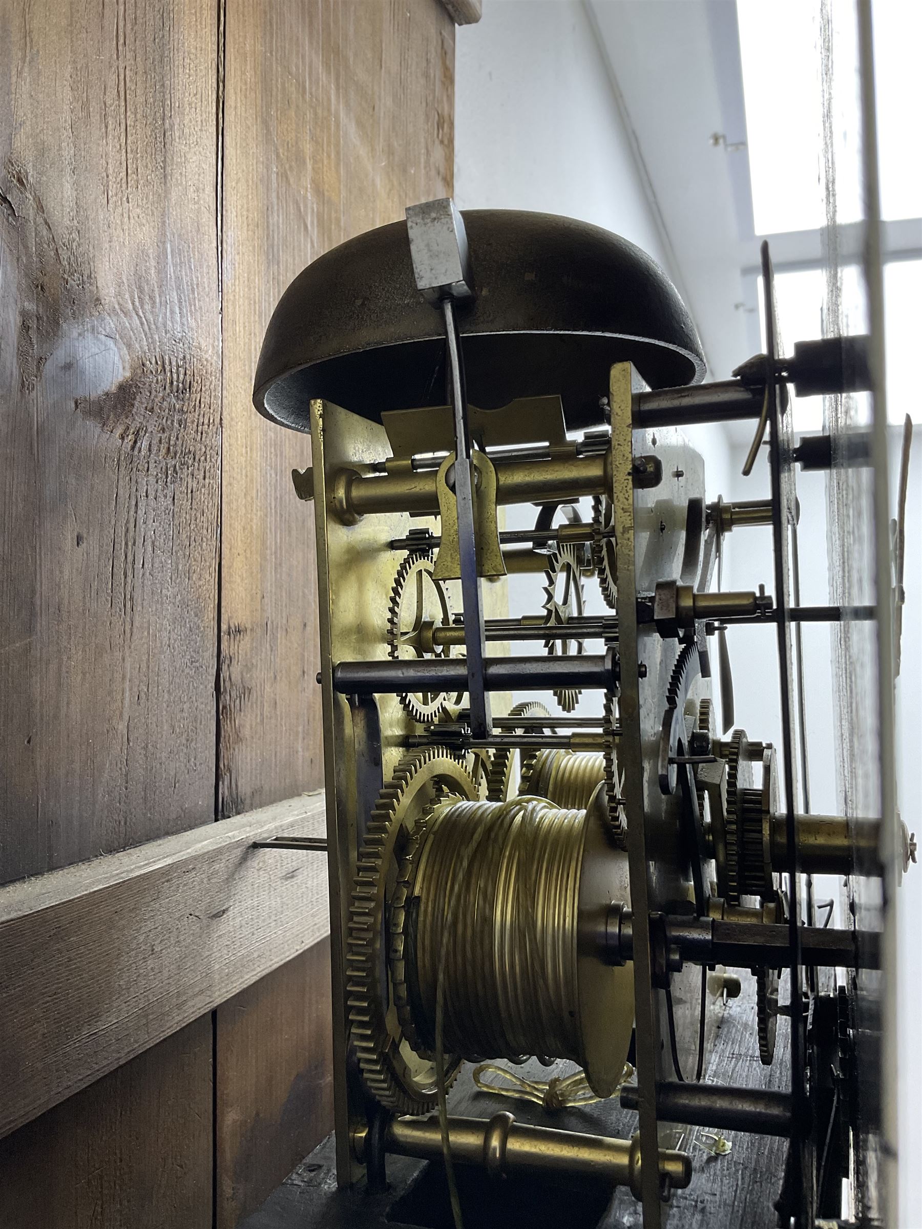Thomas Gibson of Berwick - oak and mahogany 8-day longcase clock c 1860, with a flat topped pediment and recessed break arch door beneath, free standing pilasters with brass capitals, trunk with quarter columns to the corners and a wavy topped door, on a rectangular oak plinth with a shaped base,  painted dial with floral spandrels and a sporting scene to the break arch, Roman numerals, minute track and subsidiary seconds and date dial's, matching stamped brass hands pinned via a false plate to a rack striking movement, striking the hours on a bell. With weights, pendulum and key.   