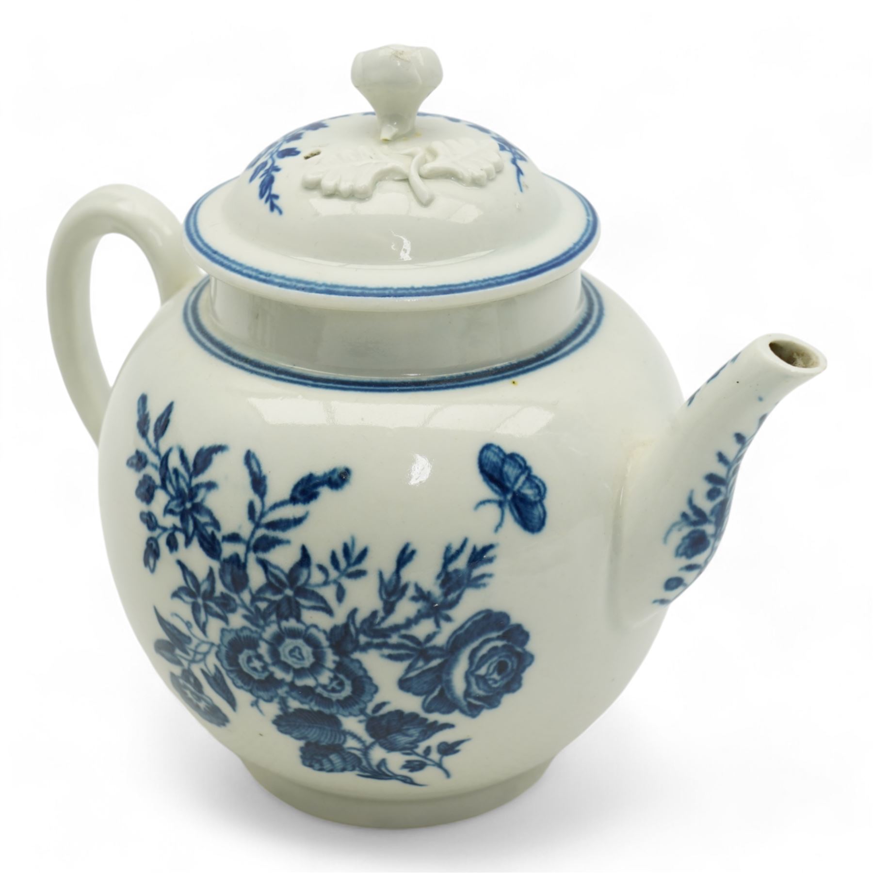 First Period Worcester porcelain teapot decorated in the Three Flowers pattern, with flower knop handle, H15cm and Worcester fluted dish decorated in the same pattern, both with cresent marks beneath (2)