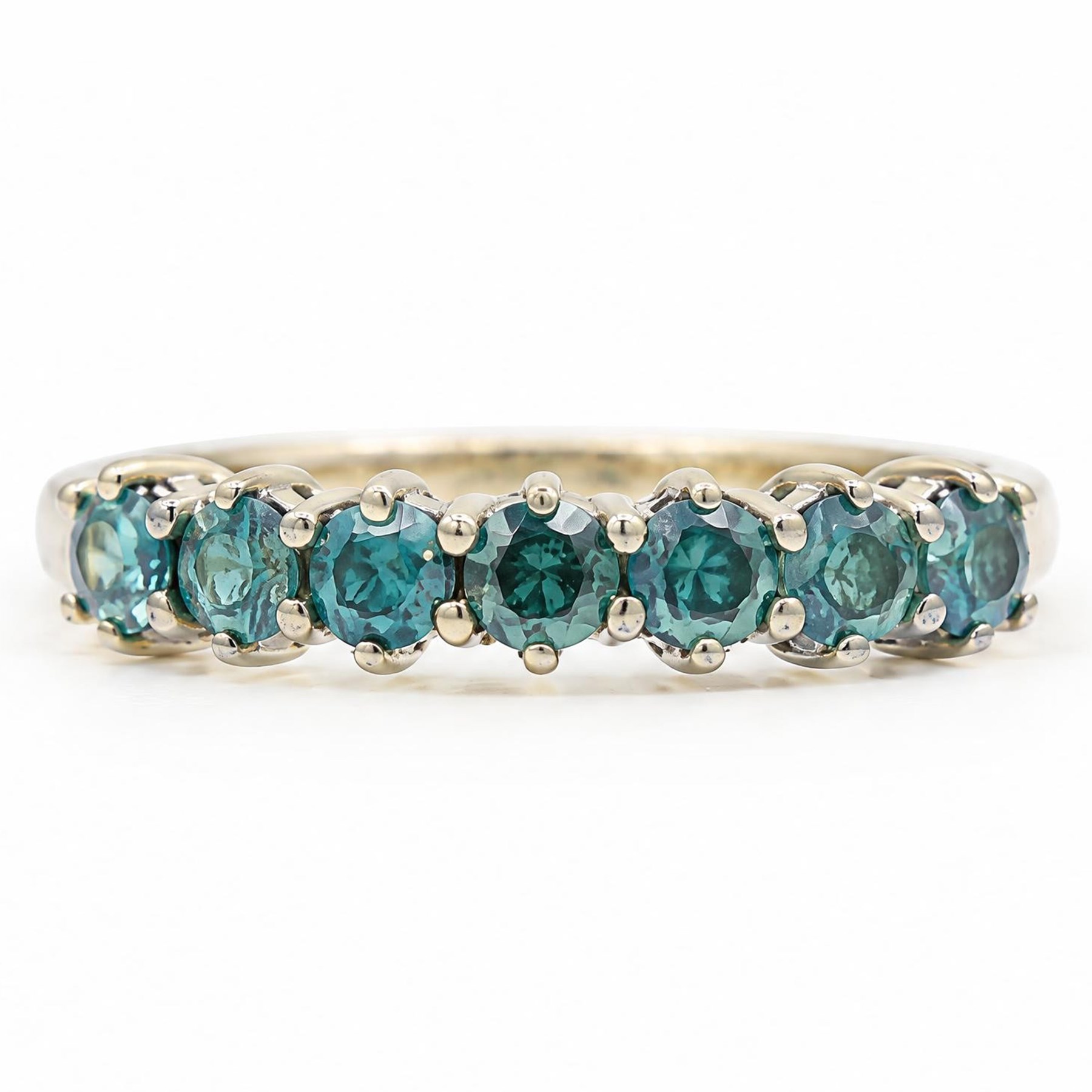 14ct white gold fancy blue diamond ring, set with seven round brilliant cut diamonds, stamped 14k, total diamond weight 0.94 carat