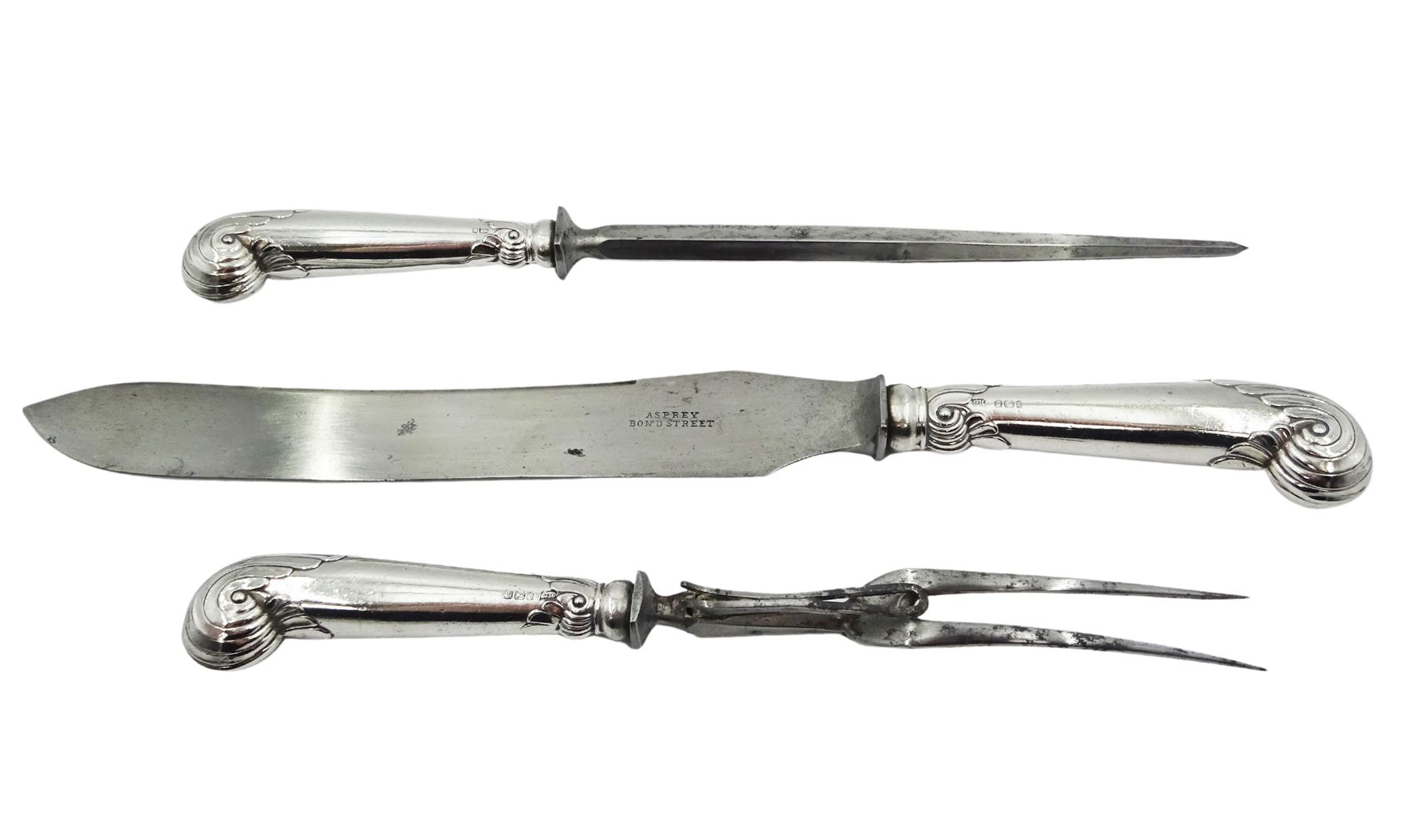 Edwardian silver handled three piece carving set, the knife blade stamped Asprey Bond Street, hallmarked Harrison Brothers & Howson, Sheffield 1903, contained within a fitted case, the interior silk lining marked Asprey 166 Bond St London 