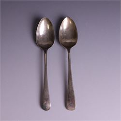 Two George III Old English pattern silver spoons, each engraved with arm and hammer crest ...
