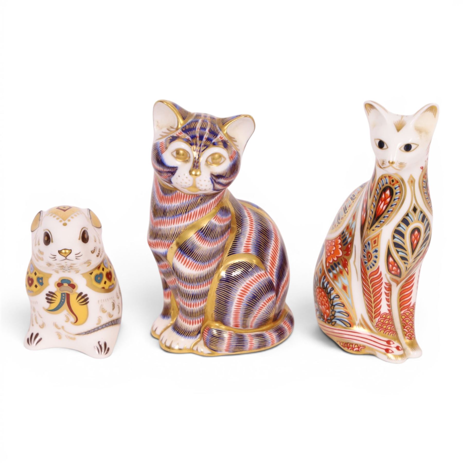 Three Royal Crown Derby paperweights, comprising Field Mouse gold stopper, Siamese cat gold stopper and seated cat gold stopper