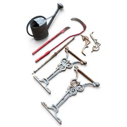 Assorted garden and architectural salvage, comprising a galvanised watering can, two long-handled cutting tools, metal pole, pair of ornate cast iron supports and further decorative fragments
