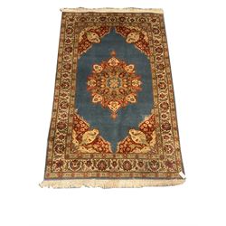 Persian style blue ground rug, repeating border, central medallion