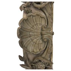 Early 20th century figural torchère, modelled as a standing putto supporting a circular top with tasselled drapery effect, raised on a circular base with foliate moulding; together with a 19th century large carved wood fragment, triangular form with high relief fruit, foliage and shell motif (H23cm, W129cm)