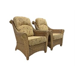 Four piece cane conservatory suite - two seat sofa (W130cm), pair of armchairs (W85cm), and coffee table (85cm x 60cm)