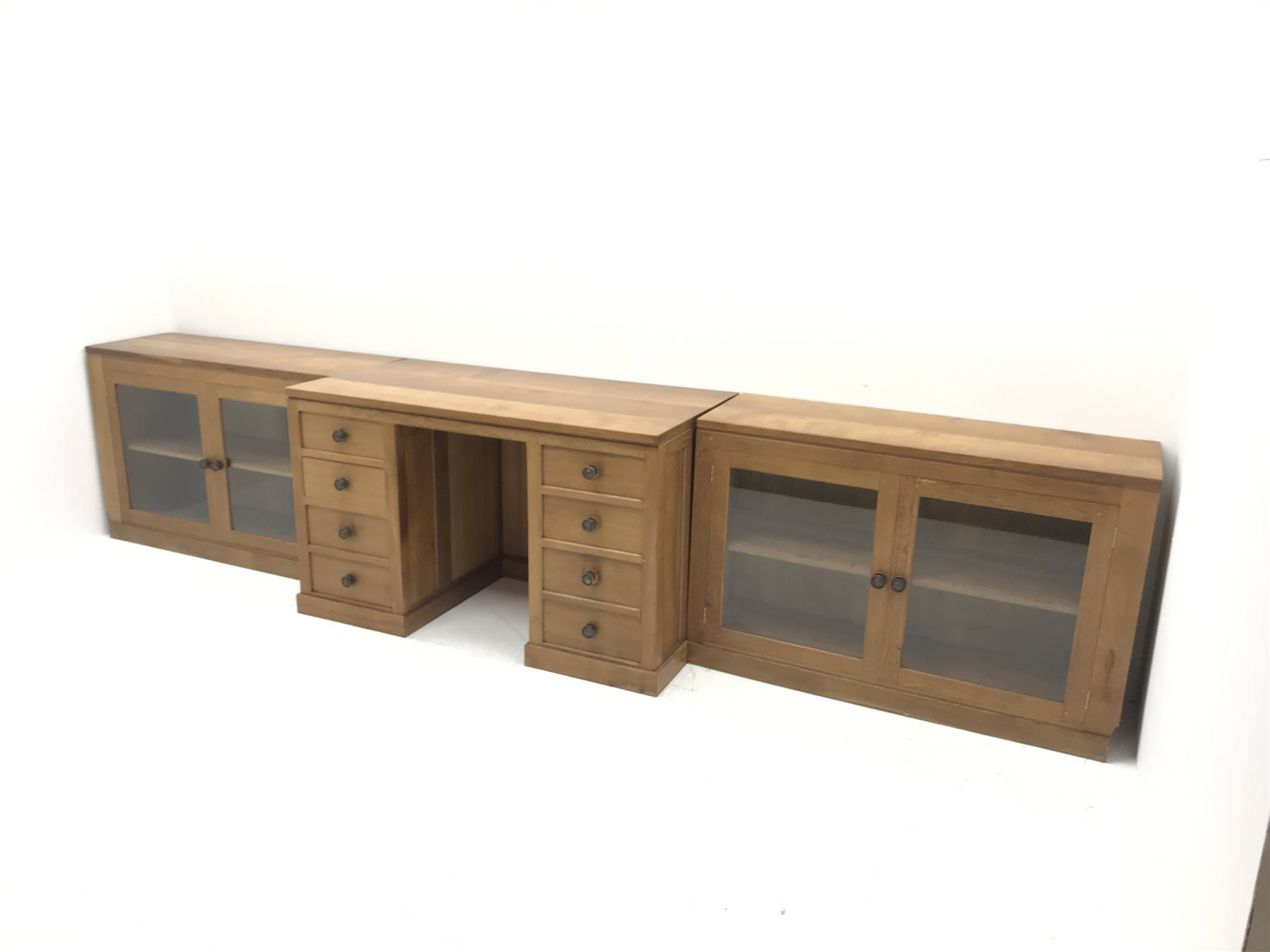 'Lizardman' oak kneehole desk fitted with six drawers and two glazed bookcases, by Derek Slater of Crayke, W347cm, H72cm, D61cm