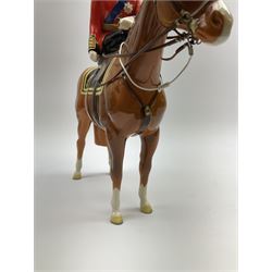 A Beswick model of HM Queen Elizabeth II mounted on Imperial Trooping the colour 1957, model no 1546, H26.5cm.